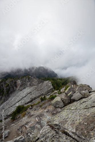 Beautiful View of Canadian Mountain Landscape during a cloudy summer morning. Taken on Crown Mountain, North Vancouver, British Columbia, Canada.