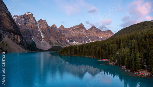 Beautiful view of an Iconic Famous Place  Moraine Lake  during a vibrant summer sunrise. Located in Banff National Park  Alberta  Canada.