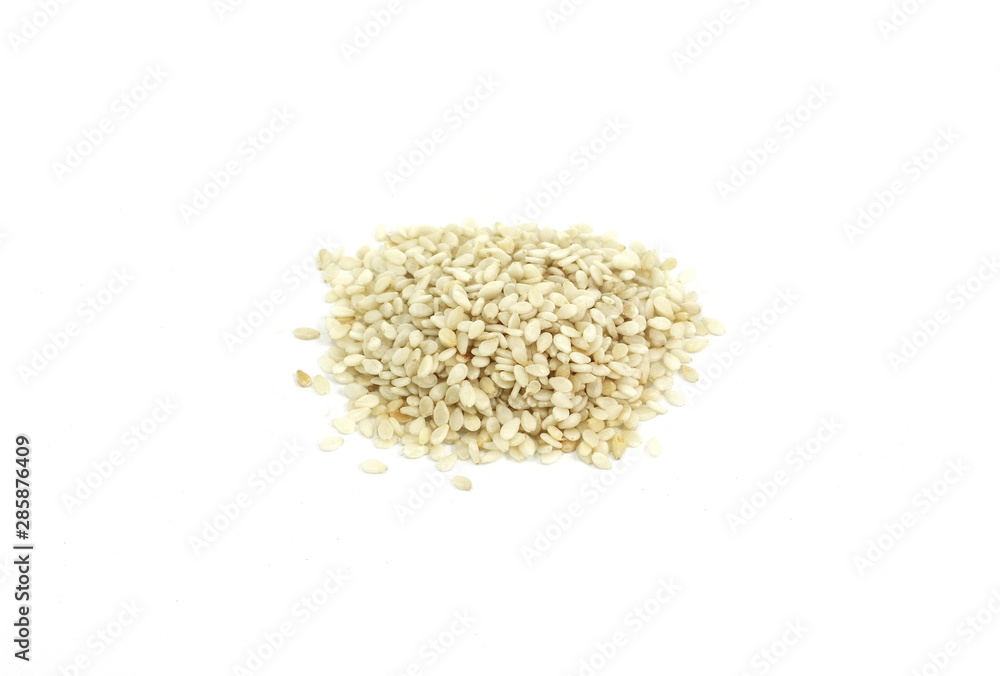 A sesame seeds isolated on a white background. A sesame seeds isolated on a white background.