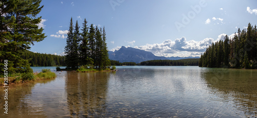 Fototapeta Naklejka Na Ścianę i Meble -  Beautiful View of Two Jack Lake during a sunny summer day. Taken in Banff National Park, Alberta, Canada.