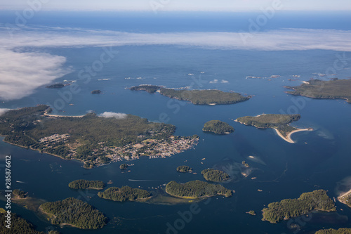 Aerial Landscape View of a touristic town  Tofino  on the Pacific Ocean Coast during a sunny summer morning. Taken in Vancouver Island  British Columbia  Canada.