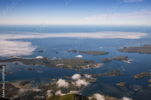 Aerial Landscape View of a touristic town, Tofino, on the Pacific Ocean Coast during a sunny summer morning. Taken in Vancouver Island, British Columbia, Canada.