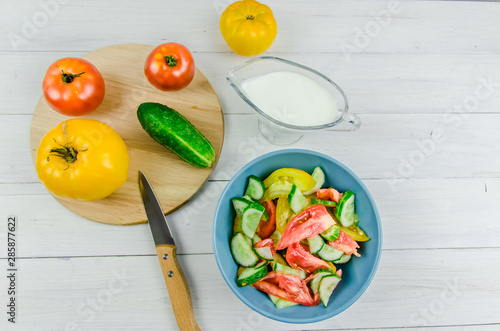 salad with cucumbers and tomatoes on white background