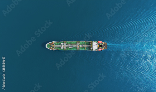 Aerial top view Oil ship tanker delivery oil from refinery on the sea.