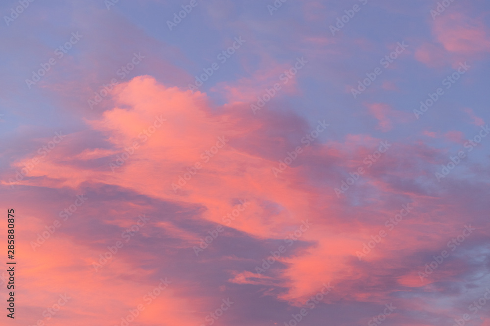 Pink colorful clouds on a blue sky.