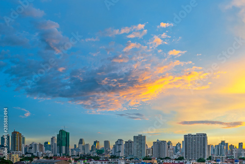 The modern skyscrapers and urban skyline of Bangkok during a colorful sunrise, Thailand.