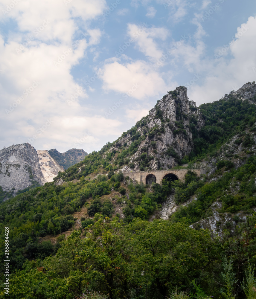 View of approach to the marble quarries in the Apuan Alps mountains, near Carrara, Italy. Famous for white marble, but also popular with tourists.