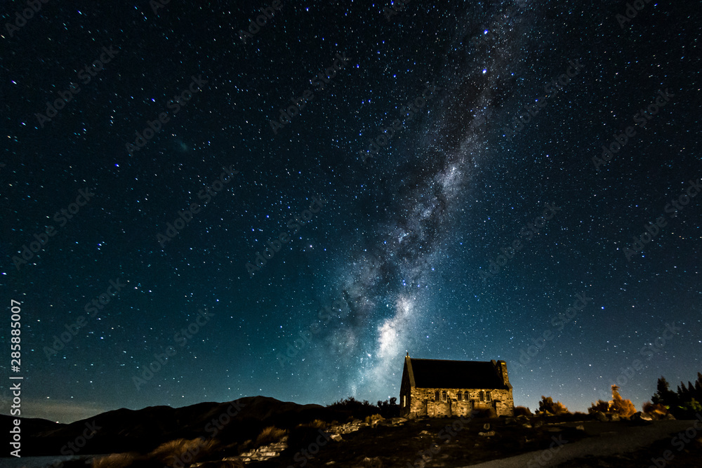 Backgrounds night sky with stars and milky way over the church at tekapo lake south island new zealand Backgrounds night sky with stars and milky way over the church at tekapo lake south island new zealand