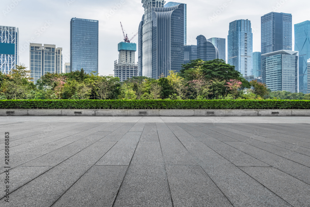 Panoramic skyline and buildings with empty square floor.