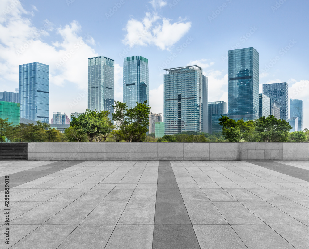 Panoramic skyline and buildings with empty square floor.