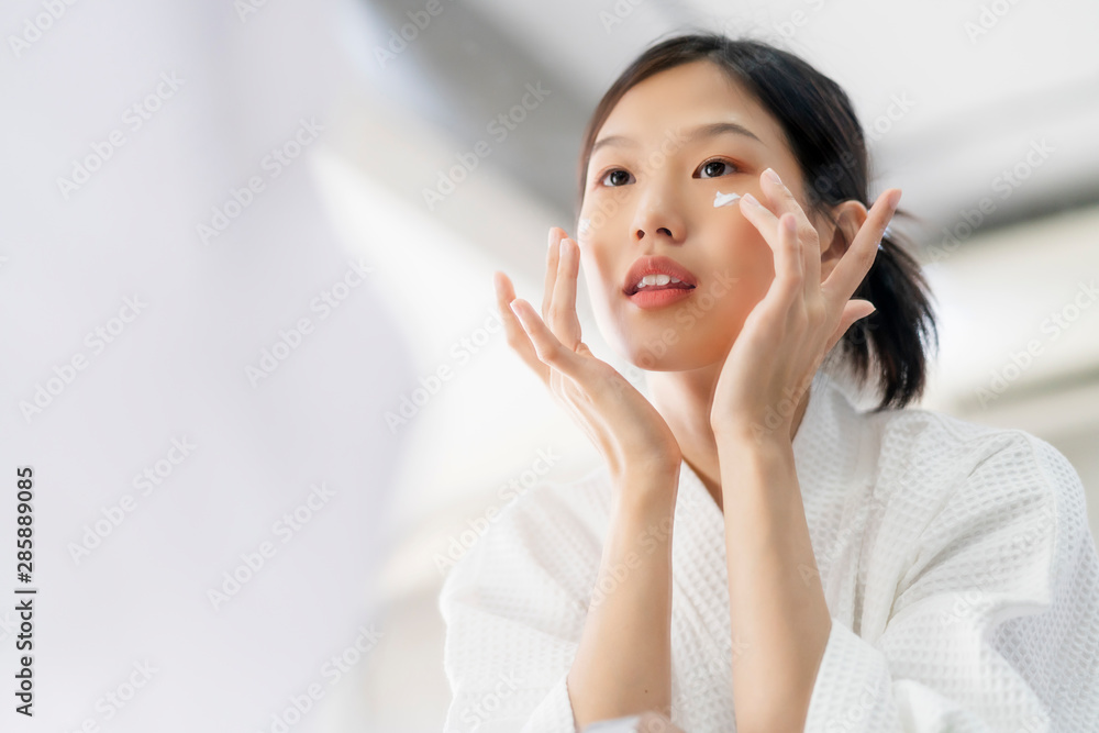 attractive freshness asian woman clean face fresh water with care look to mirror in bathroom home background attractive freshness asian woman clean face fresh water with care look to mirror in bathroom home background