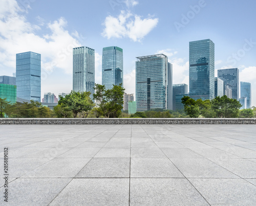 Panoramic skyline and buildings with empty square floor.