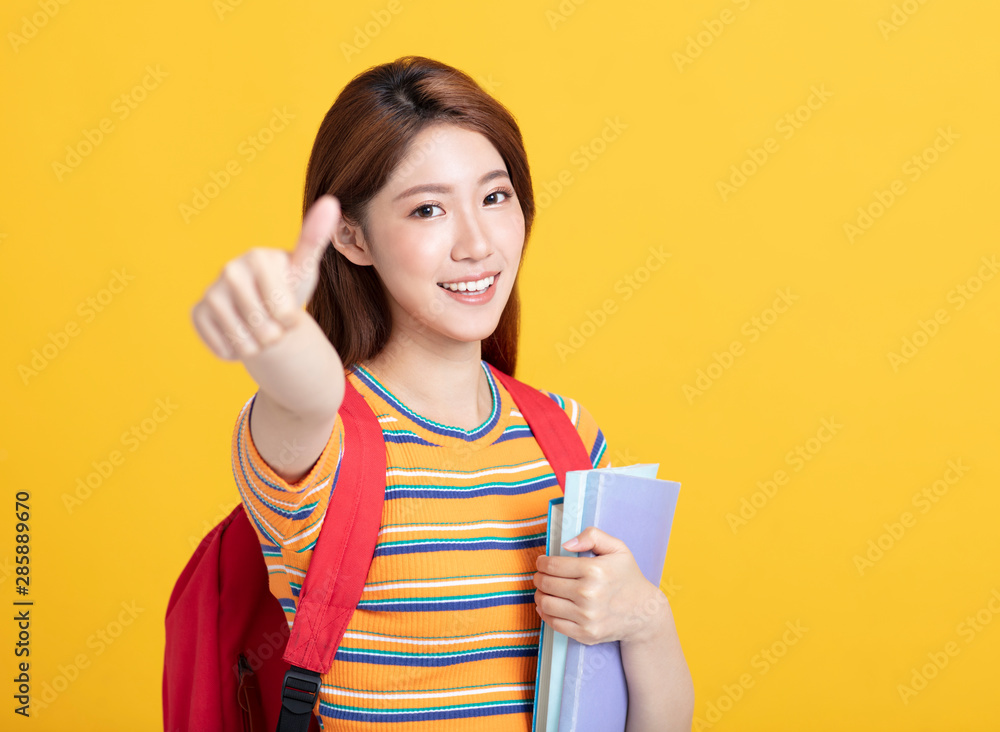 Portrait of beautiful asian student holding books Portrait of beautiful asian student holding books