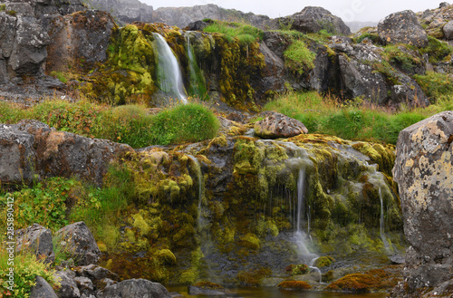 Long exposure photo of waterfall, view of the small waterfall in Westfjords of Iceland, Europe.