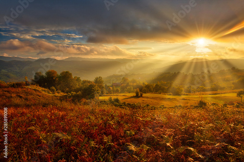 Magestic sunset in the carpatian mountains. Natural autumn landscape. photo