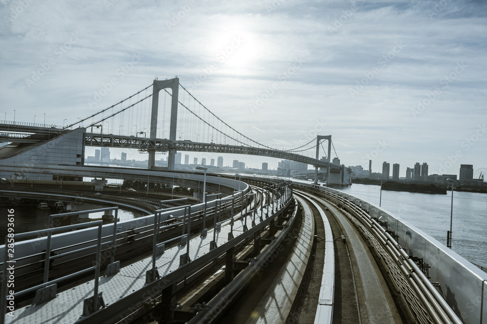 Obraz premium Rainbow bridge and elevated monorail road in Tokyo