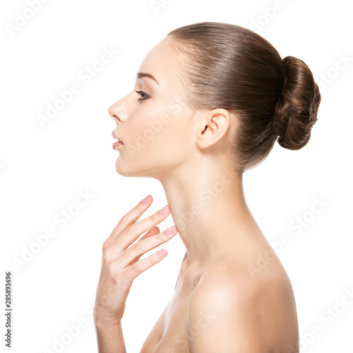 Beautiful woman cares for the neck photo