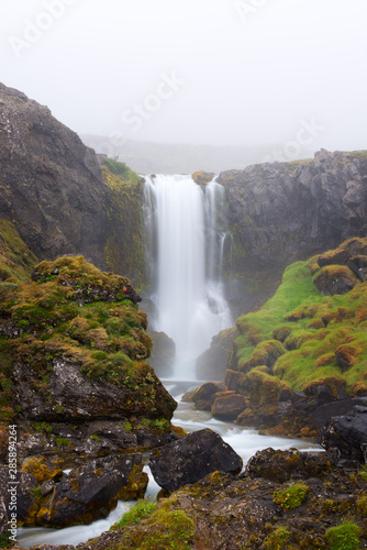 Long exposure photo of waterfall  view of the small waterfall in Westfjords of Iceland  Europe.