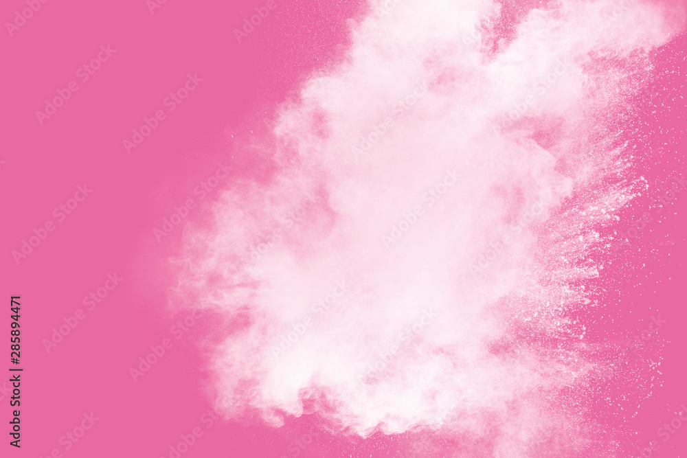 Abstract white powder explosion on pink background. Freeze motion of white dust splattered. Abstract white powder explosion on pink background. Freeze motion of white dust splattered.