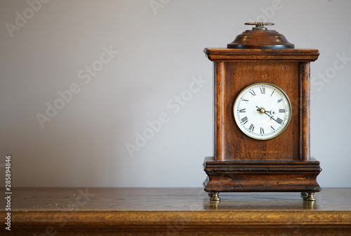 old wooden clock isolated on white background