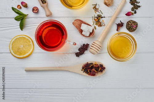 Flat lay composition with honey and tea. Hot winter beverage concept.