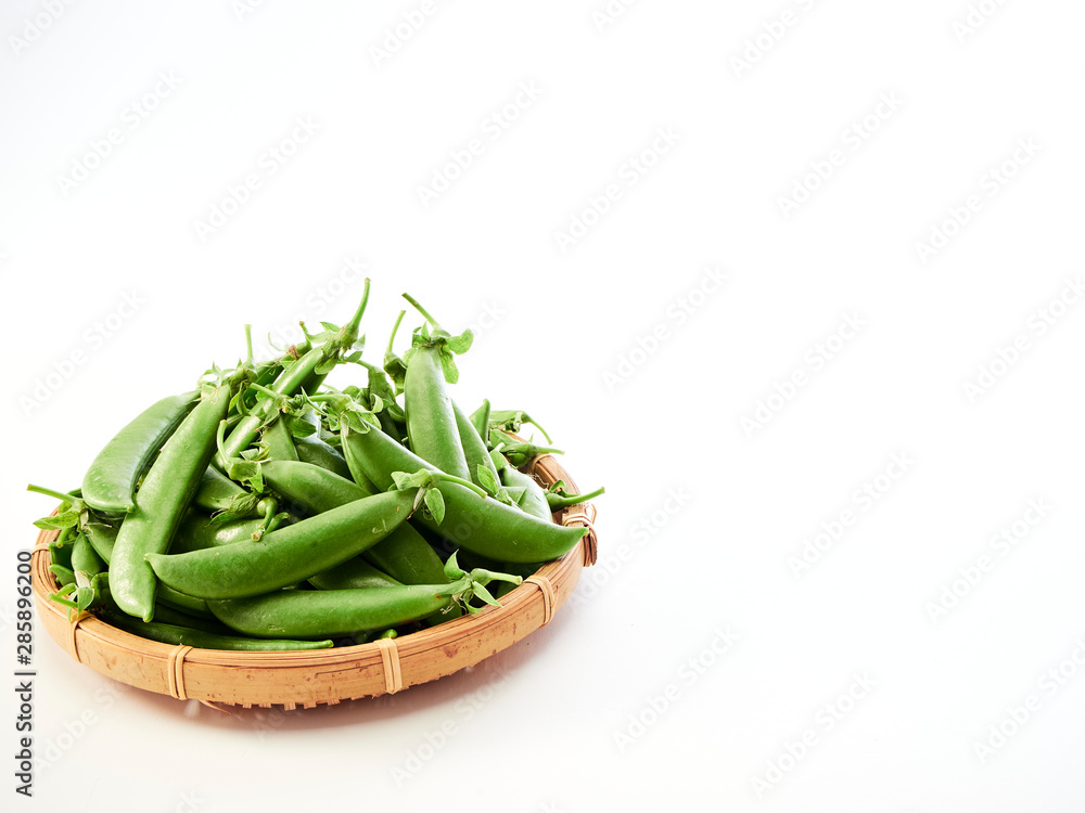 green pea pod In a bamboo container green pea pod In a bamboo container
