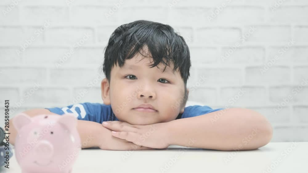 Asian little boy is smiling on student desk. Asian little boy is smiling on student desk.