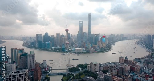 Shanghai skyline aerial footage with amazing skyscrapers rising above Haungpu river cityscape in China photo