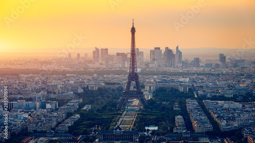 Panoramic aerial view of Paris, Eiffel Tower and La Defense business district. Aerial view of Paris at sunset. Panoramic view of Paris skyline with Eiffel Tower and La Defense. Paris, France.