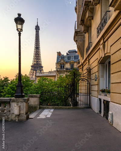 Cozy street with view of Paris Eiffel Tower in Paris, France. Eiffel Tower is one of the most iconic landmarks in Paris. Architecture and landmark of Paris. Eiffel tower in summer, Paris, France. © daliu