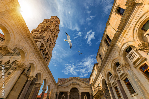 Diocletian's Palace's peristyle in front of Cathedral of Saint Domnius' bell tower in Split, Croatia. Diocletian palace UNESCO world heritage site in Split, Dalmatia, Croatia. photo