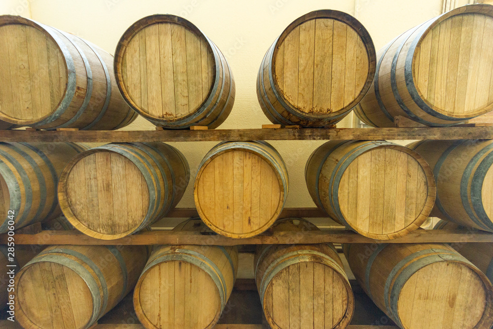Barrels of Wine stored in a Winery in Italy Barrels of Wine stored in a Winery in Italy