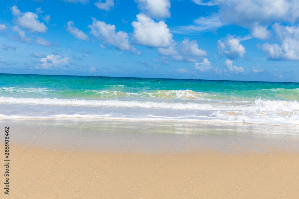 Tropical sea beach white wave against blue sky cloud