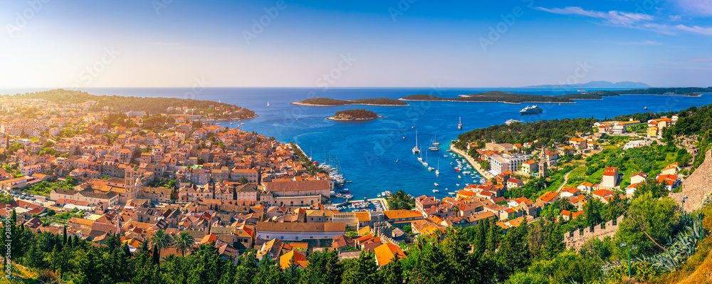 Panorama view at amazing archipelago in front of town Hvar, Croatia. Harbor of old Adriatic island town Hvar. Amazing Hvar city on Hvar island, Croatia. High resolution photo of Hvar town, Croatia. - obrazy, fototapety, plakaty 