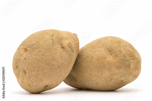 Potatoes with dirt isolated on white background