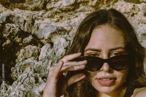 Portrait of young hipster woman with sunglasses enjoying summer. Autumn is approaching with good temperatures. autumnal beach. © Tremens Productions