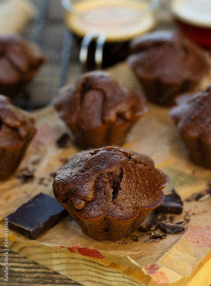 Fototapeta premium Sweet homemade chocolate muffins with chocolate served with coffee