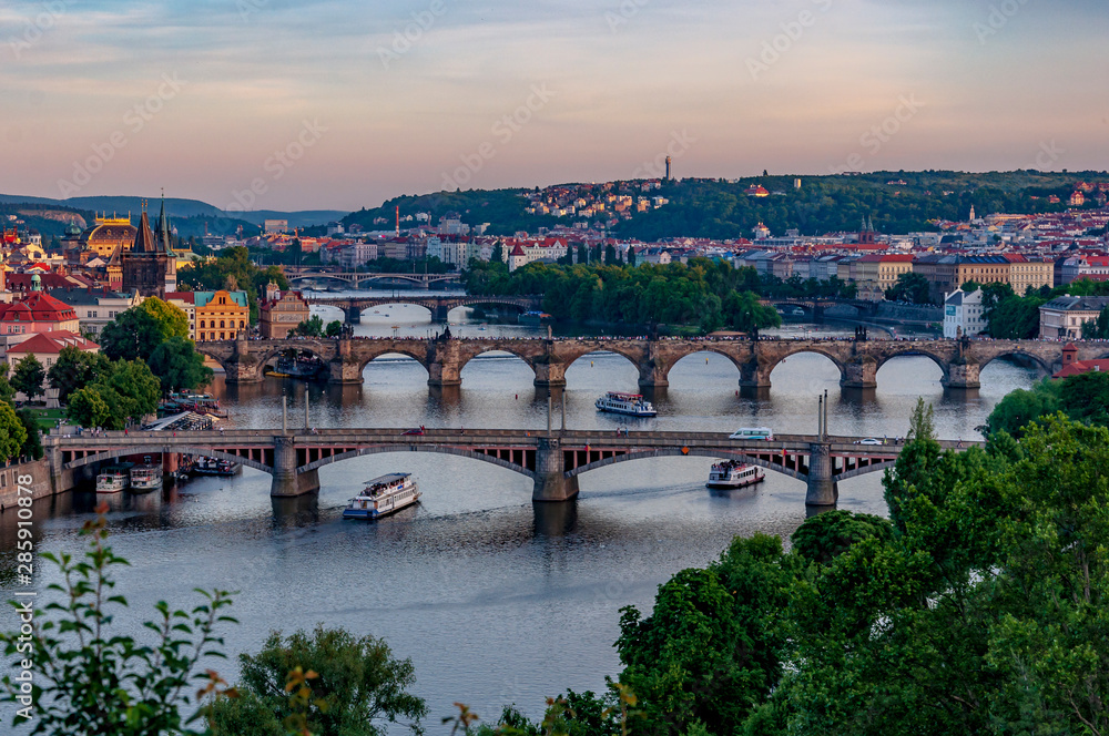 Scenic view over Prague bridges and Vltava River from Letna Hill at dusk. Beautiful view of Prague's Old Town. Prague, Czech Republic