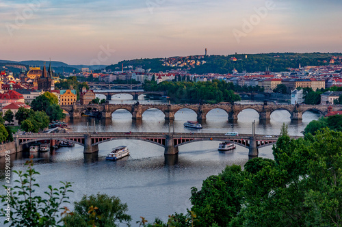 Scenic view over Prague bridges and Vltava River from Letna Hill at dusk. Beautiful view of Prague's Old Town. Prague, Czech Republic