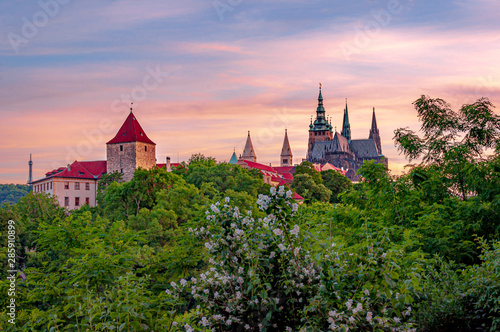 Beautiful colorful view of twilight over Prague Castle - Daliborka tower and St. Vitus Cathedral. Prague, Czech Republic photo