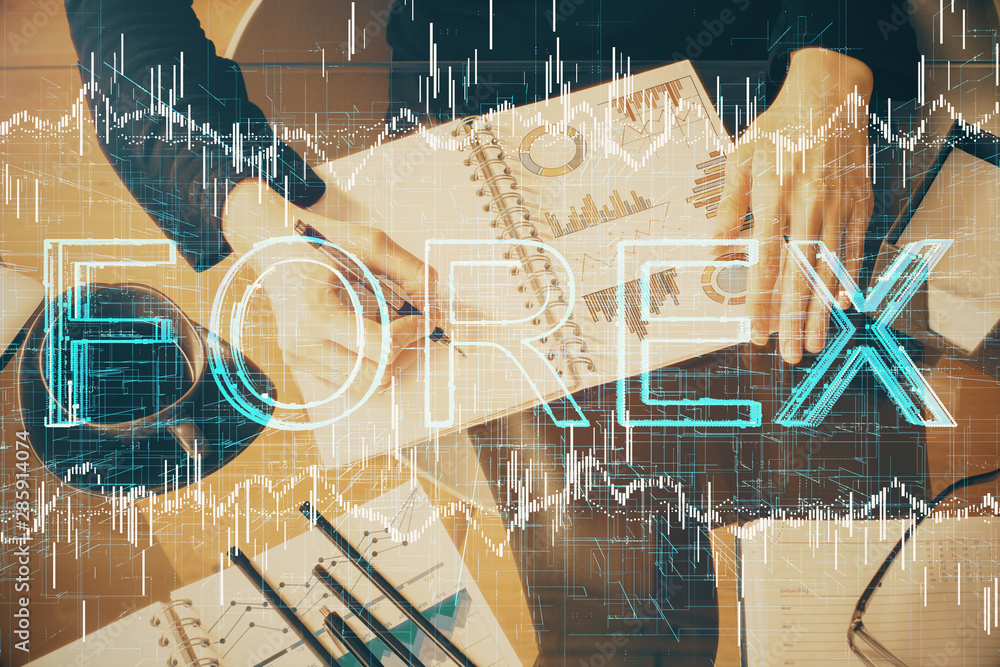 Double exposure of hands making notes with forex chart huds. Stock market concept. Double exposure of hands making notes with forex chart huds. Stock market concept.