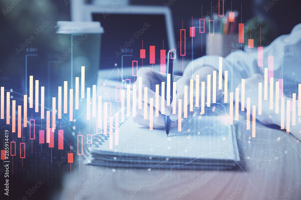 Forex chart displayed on woman's hand taking notes background. Concept of research. Double exposure Forex chart displayed on woman's hand taking notes background. Concept of research. Double exposure