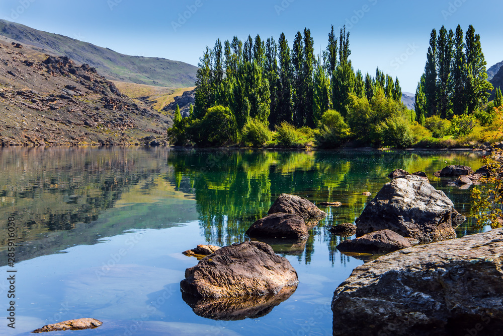 Huge boulders reflected in the lake Huge boulders reflected in the lake