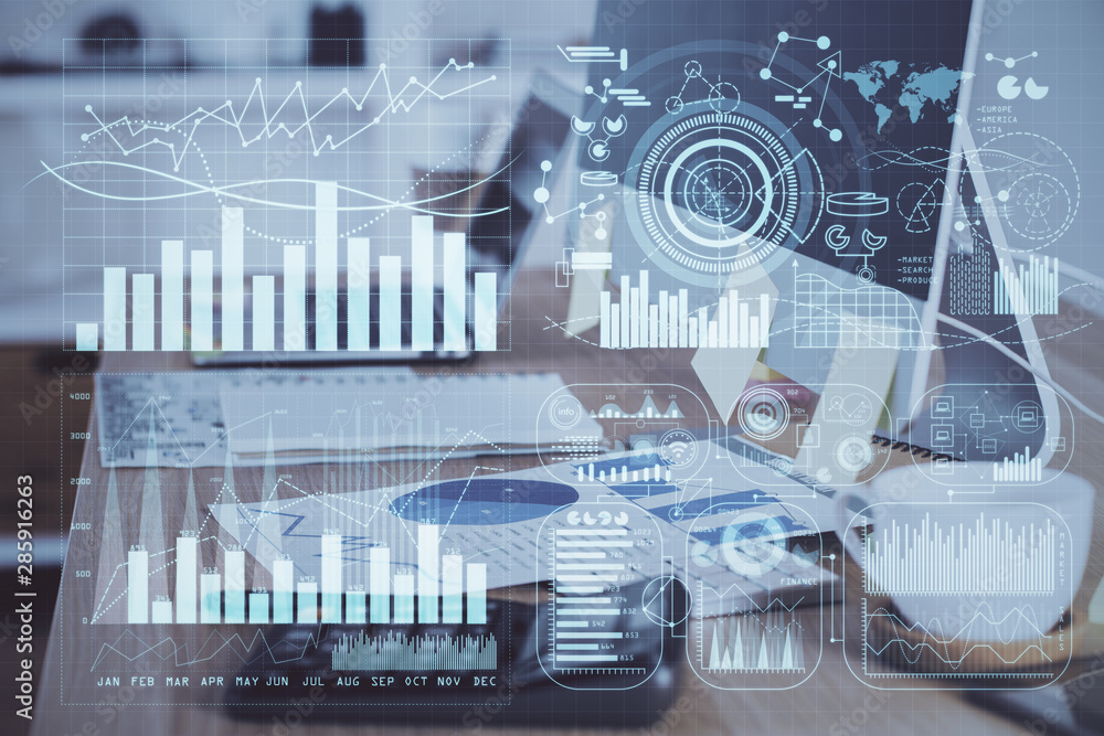 Double exposure of forex chart and work space with computer. Concept of international online trading.