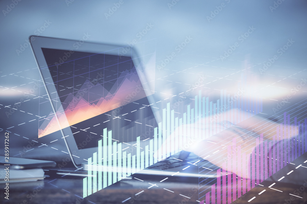 Double exposure of man's hands writing notes of stock market with forex graph background. Concept of research and trading. Double exposure of man's hands writing notes of stock market with forex graph background. Concept of research and trading.