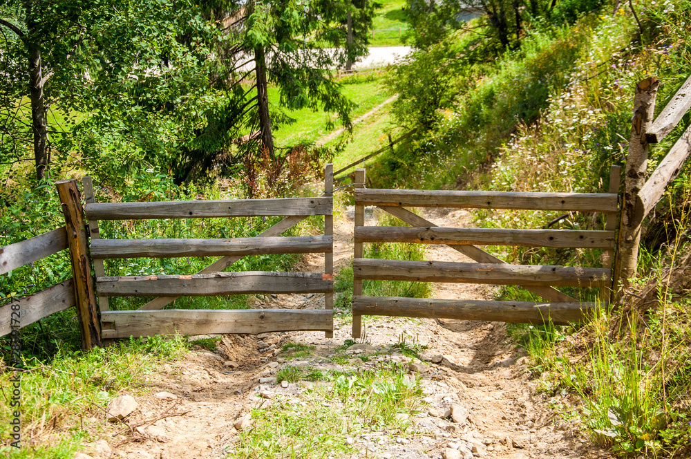 old wooden gate on the mountainside. Summer old wooden gate on the mountainside. Summer