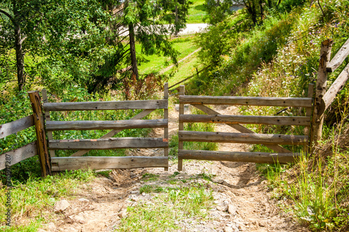 old wooden gate on the mountainside. Summer