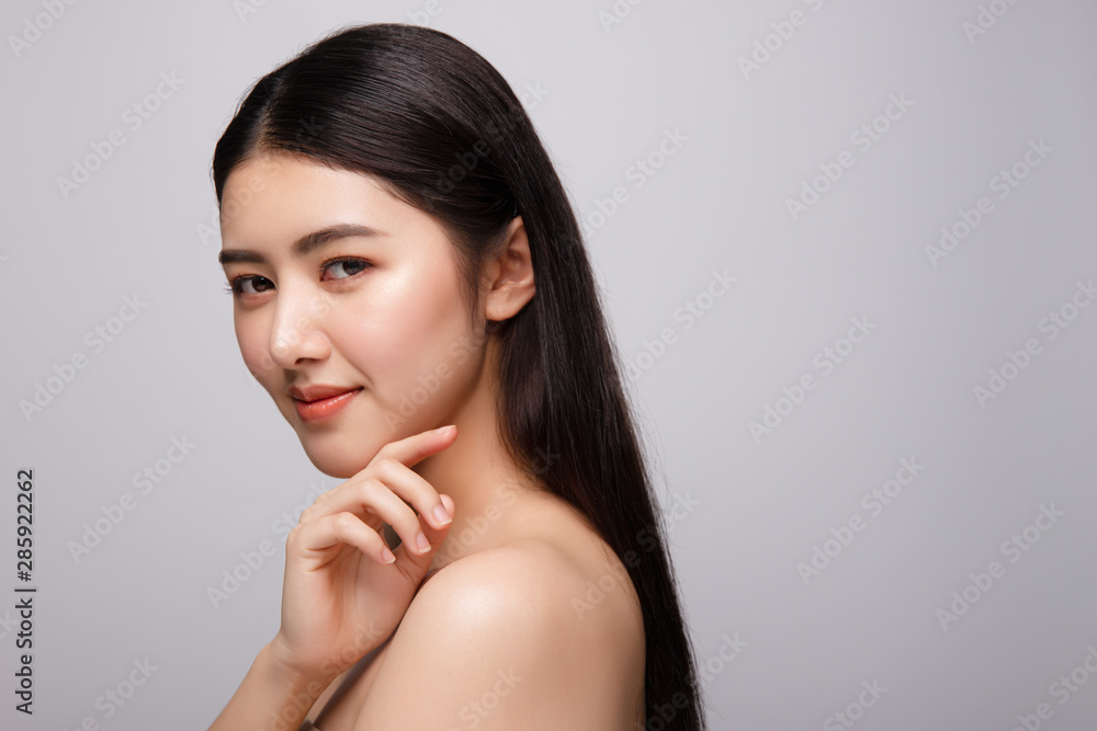 Portrait of beautiful young asian woman clean fresh bare skin concept. Asian girl beauty face skincare and health wellness, Facial treatment, Perfect skin, Natural make up. Isolated on gray background Portrait of beautiful young asian woman clean fresh bare skin concept. Asian girl beauty face skincare and health wellness, Facial treatment, Perfect skin, Natural make up. Isolated on gray background