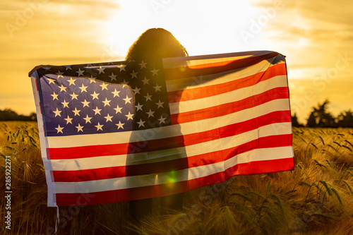 Photography Girl Teenager Wrapped in USA Flag in Field at Sunset