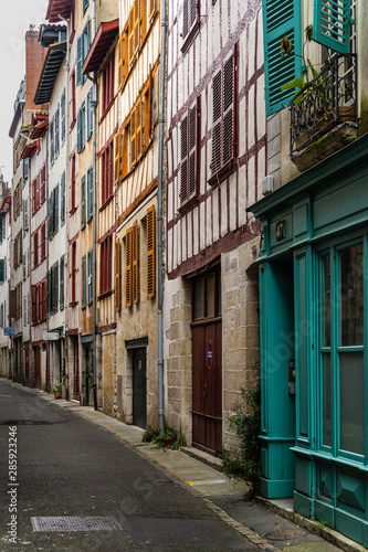 Picturesque street in Bayonne old town with tradition half timbered houses  France